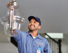 Mr. Electric Electrician Installing a Light Fixture.