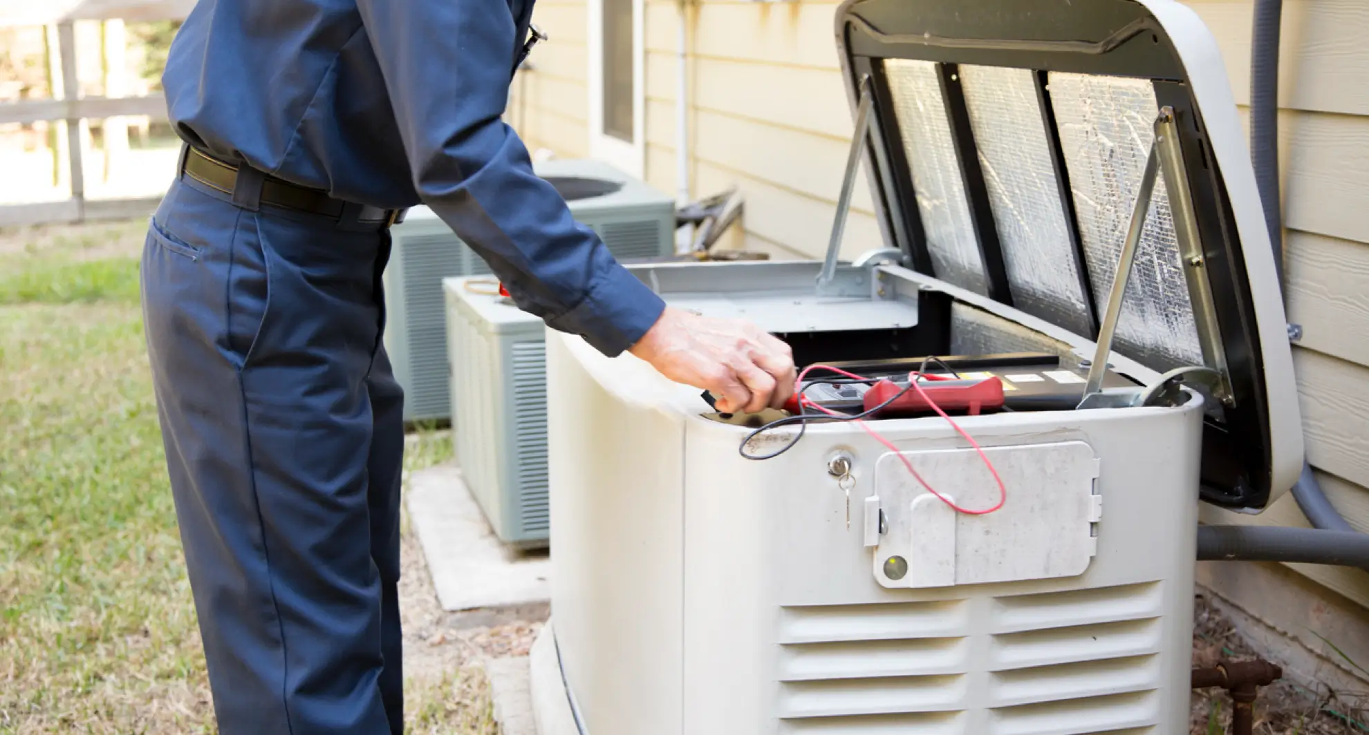 Technician inspecting home standby generator
