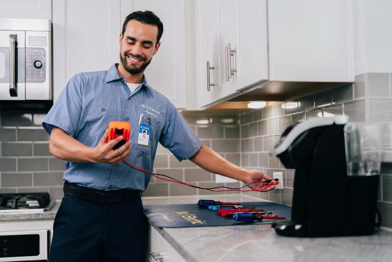 Mr. Electric electrician testing an outlet during an electrical safety inspection