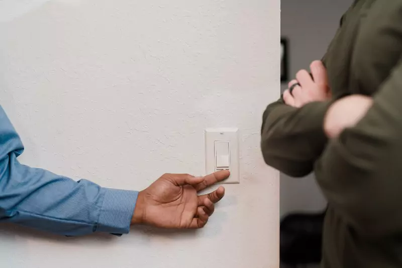 Mr. Electric electrician testing out a light switch