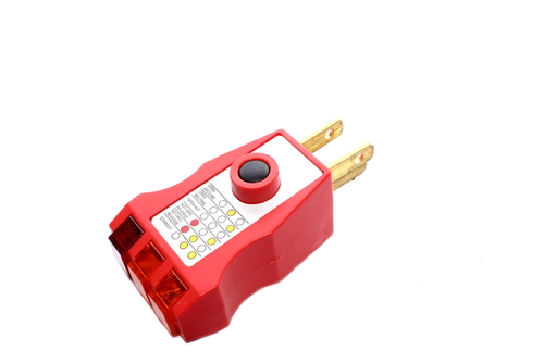 Red GFCI plug-in outlet tester.