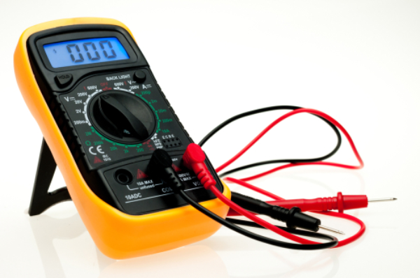 Digital multimeter and probes with a blue backlit display.